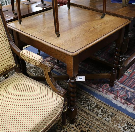 A 1920s oak barley twist square table W.77cm